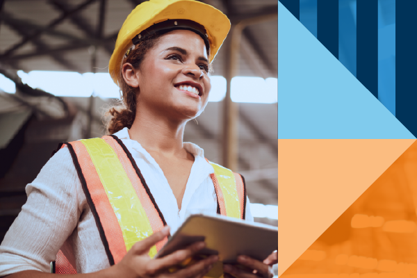 A woman wearing a hard hat and safety vest