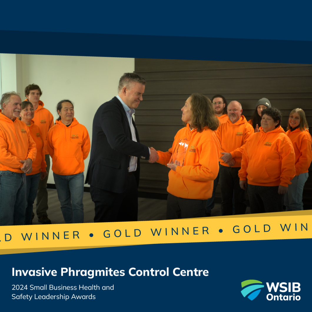 Rodney C. Cook (centre left), Vice President of Workplace Health and Safety Services, presents the gold 2025 Small Business Health and Safety Leadership Award to Janice Gilbert (centre right), Executive Director of Invasive Phragmites Control Centre.